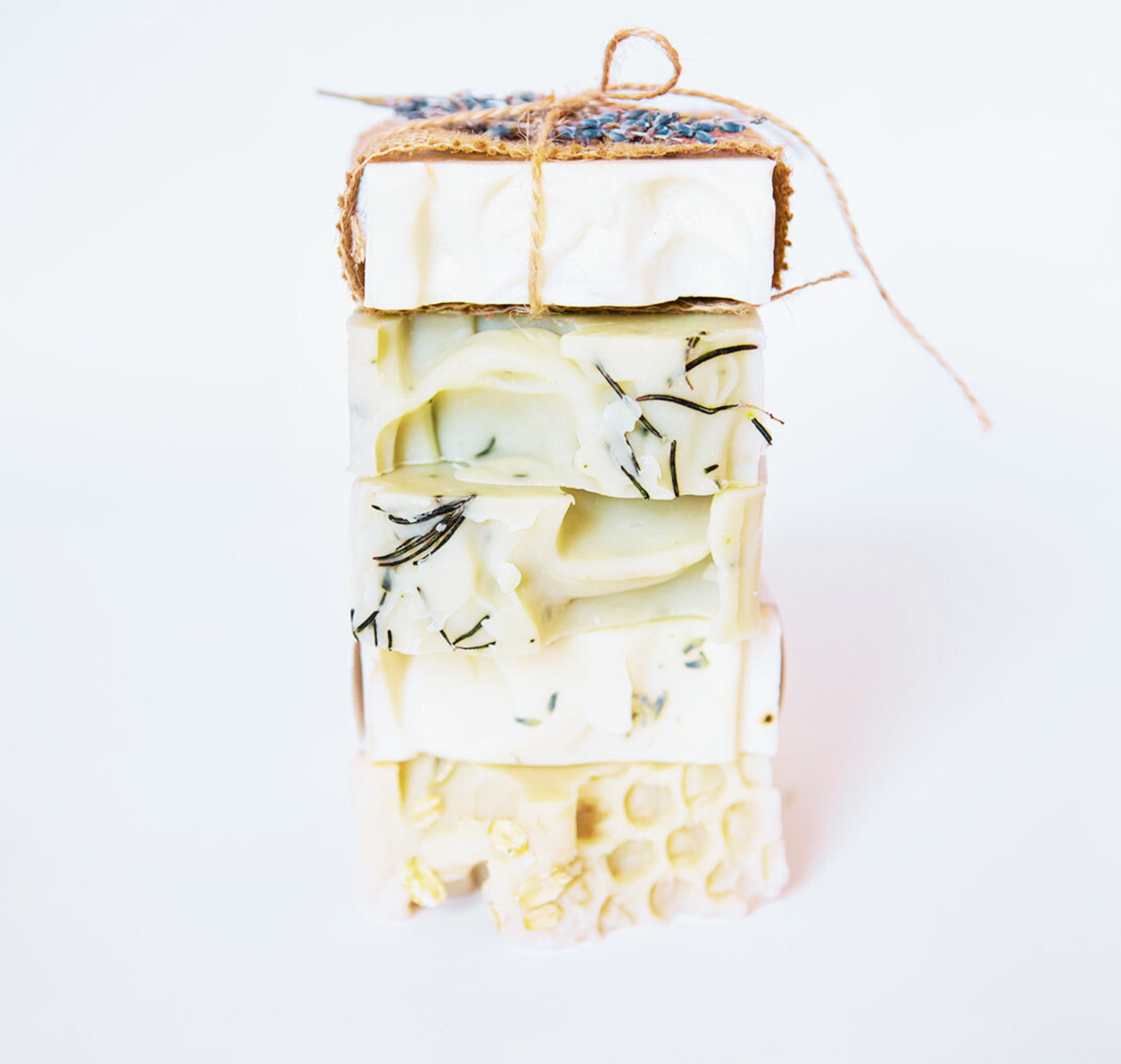 Handmade soap with natural ingredients on a white background